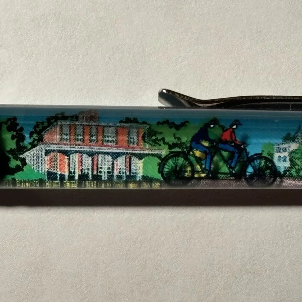 Cape May New Jersey Floaty Pen People on Tandem Bike Move by Victorian Houses